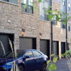 stone building with garage doors outside