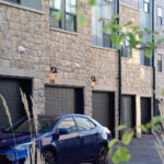 stone building with garage doors outside